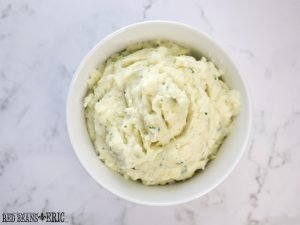 A top view of a bowl of creamy mashed potatoes using Blue Plate Mayonnaise made by Red Beans and Eric.