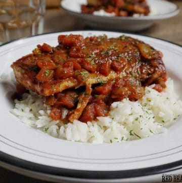 Pan fried Mahi Mahi in a Creole Sauce served over hot cooked white rice by Red Beans and Eric!